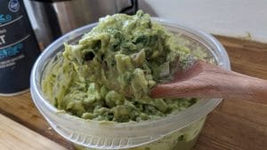 Close up of guacamole on a spoon